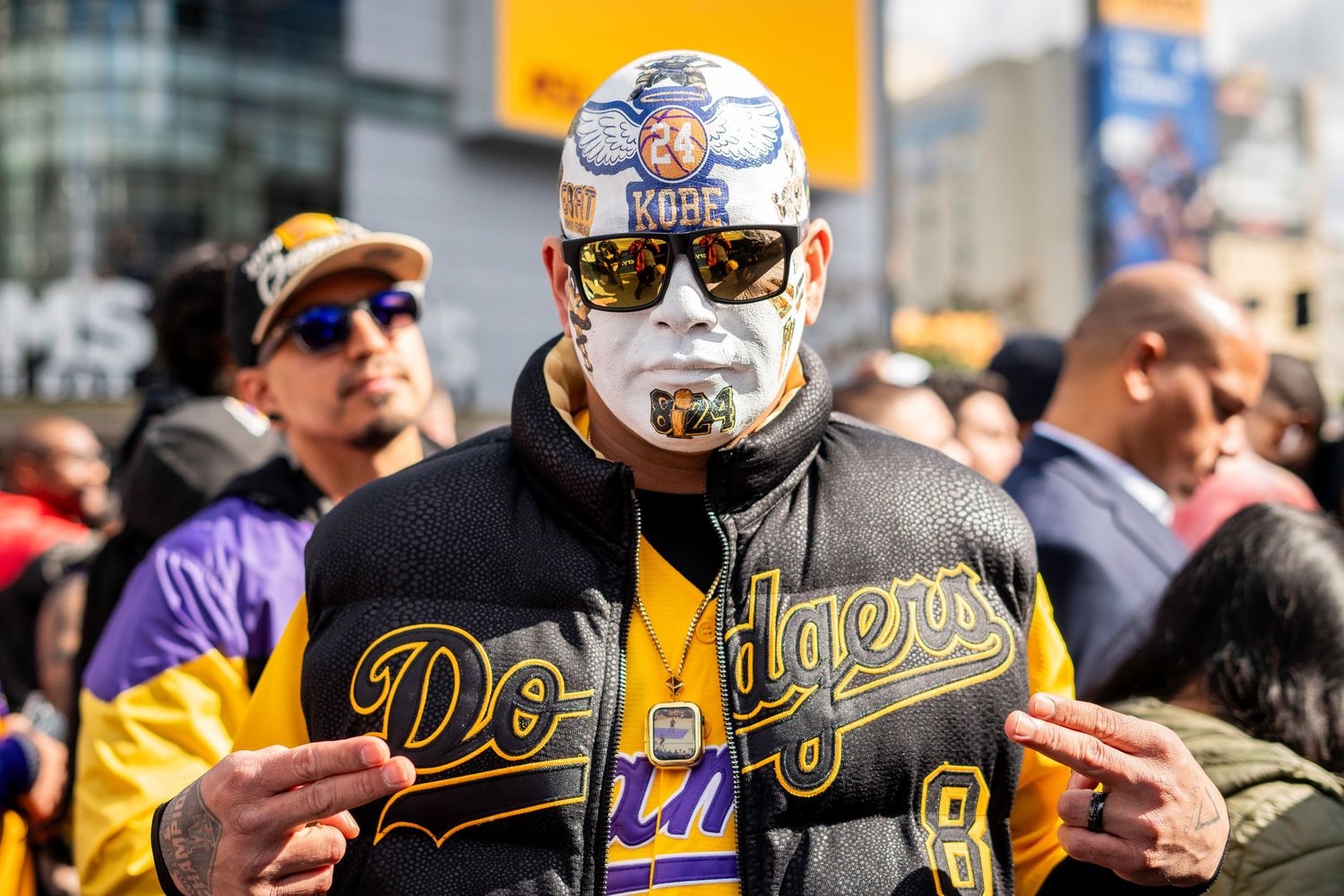 Baseball head has his portrait made at the Kobe Bryant memorial statue outside Crypto.com Arena in downtown Los Angeles,