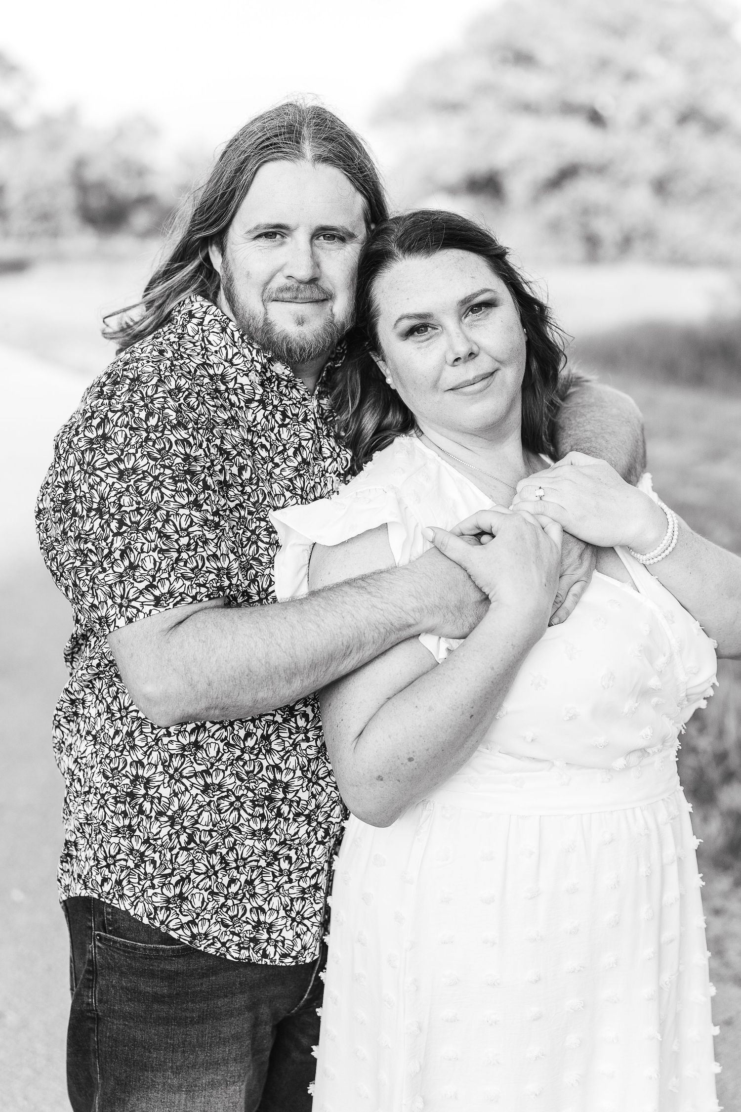 Engaged couple posing for camera during their Kenosha engagement session.