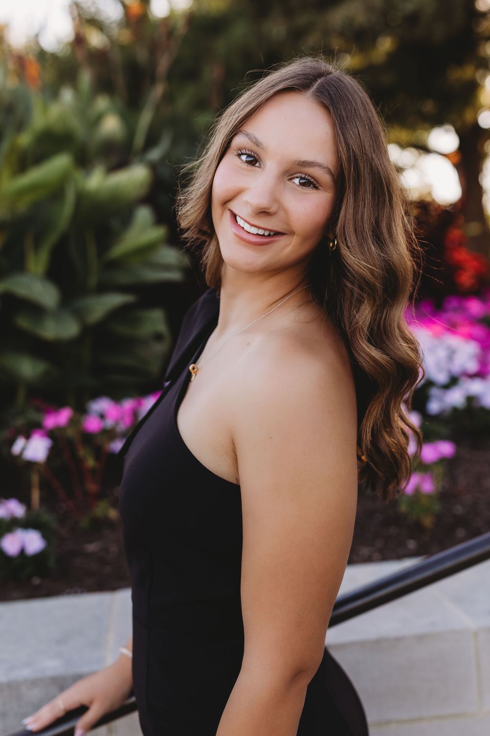 senior girl forest park art hill black dress pink flowers brunette