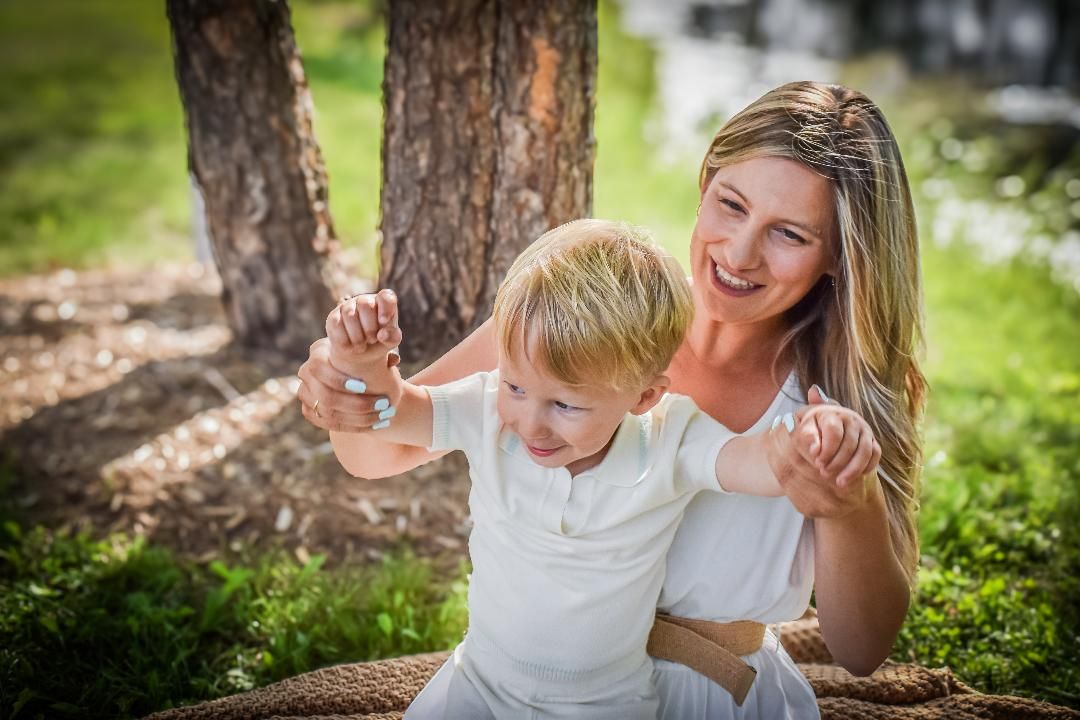 Photograph of a mother and son laughing.  Blue Onion Photography.