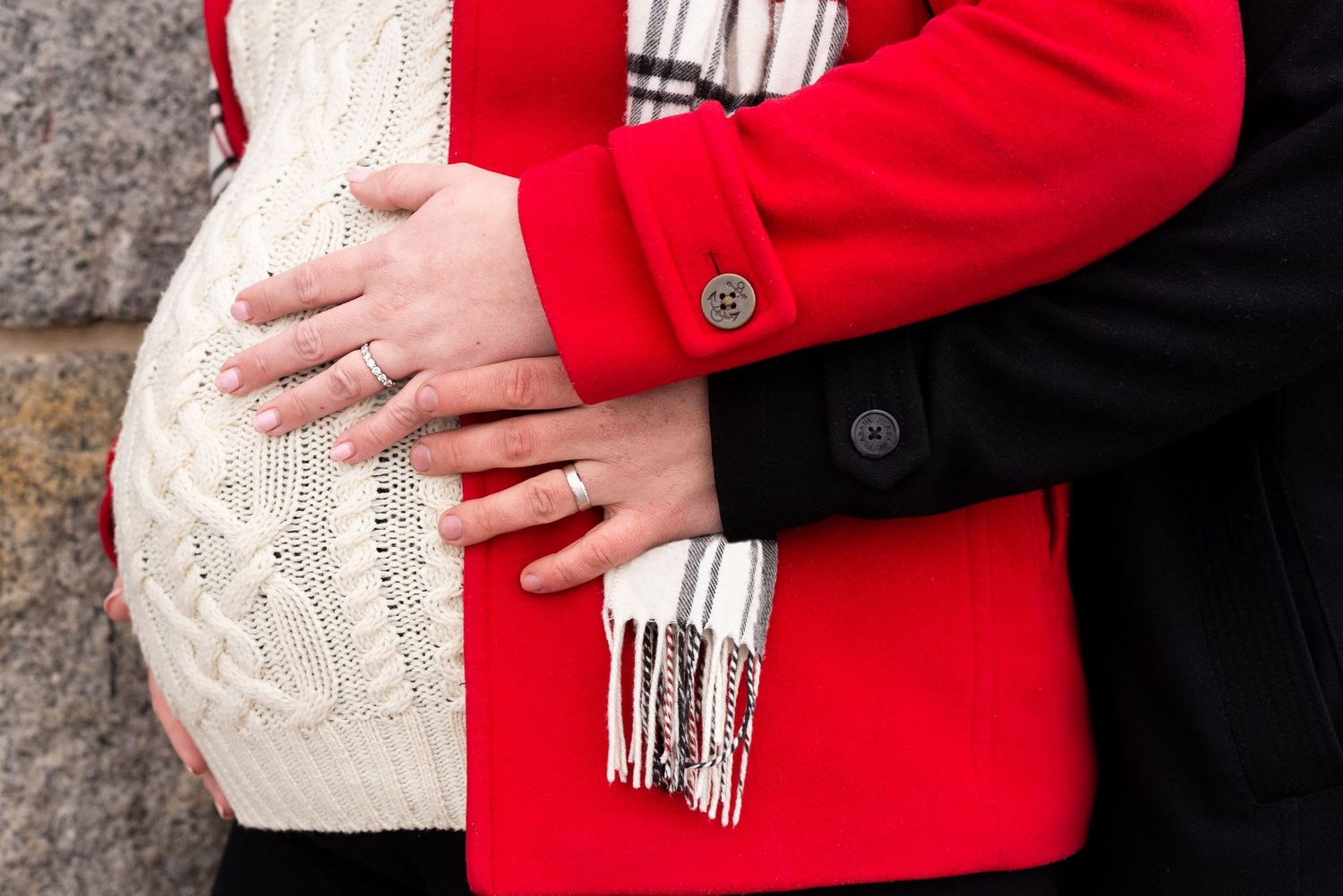 Details of mom, dad, wedding rings, and baby bump in these winter maternity portraits in Boston with Leah Ramuglia Photography.