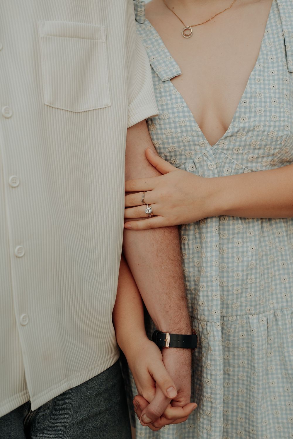 Detail shots of couple in gingham dress and white shirt showing rings and holding hands.