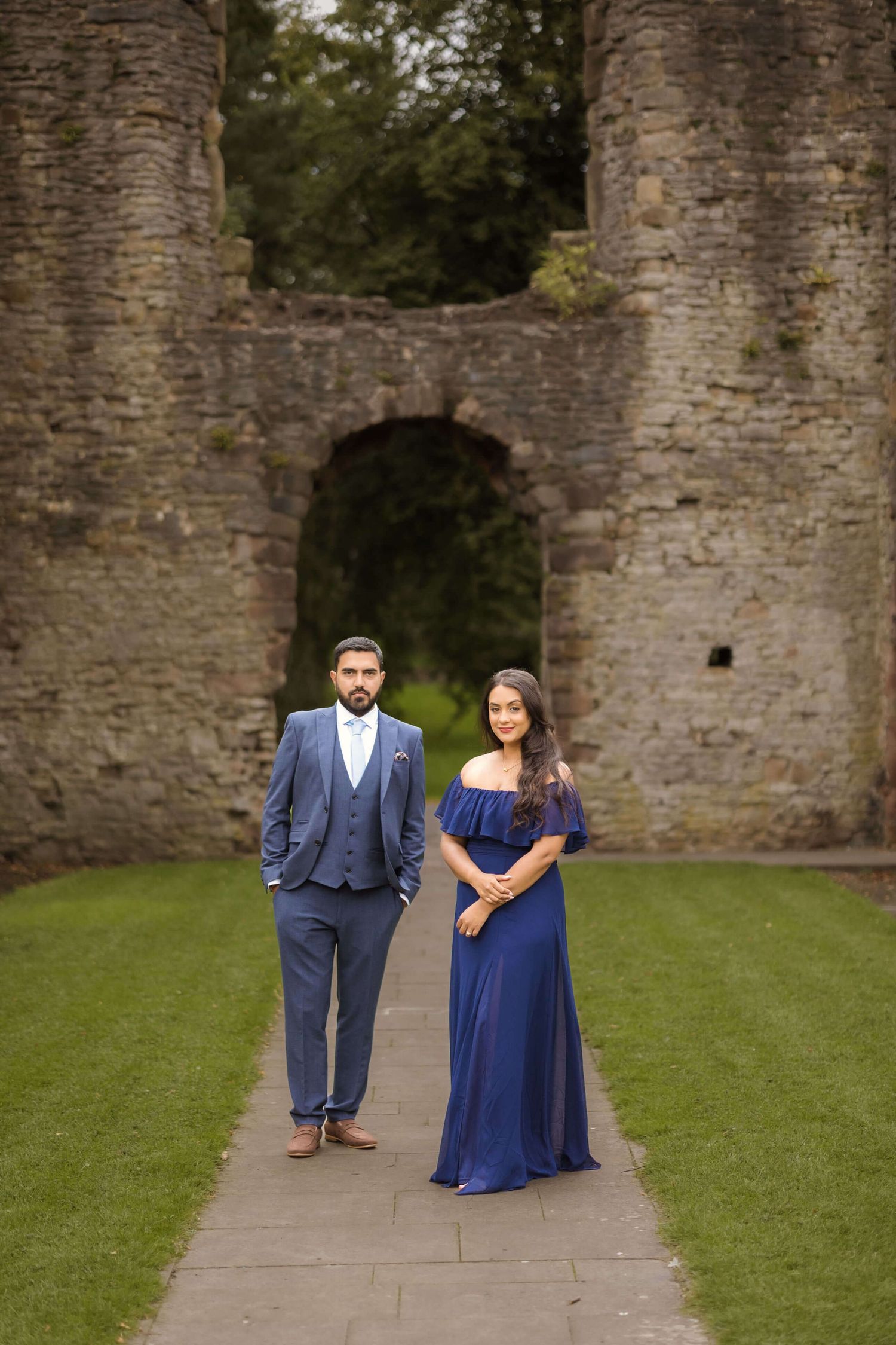 newly weds posing after their Reception looking confidently towards the camera