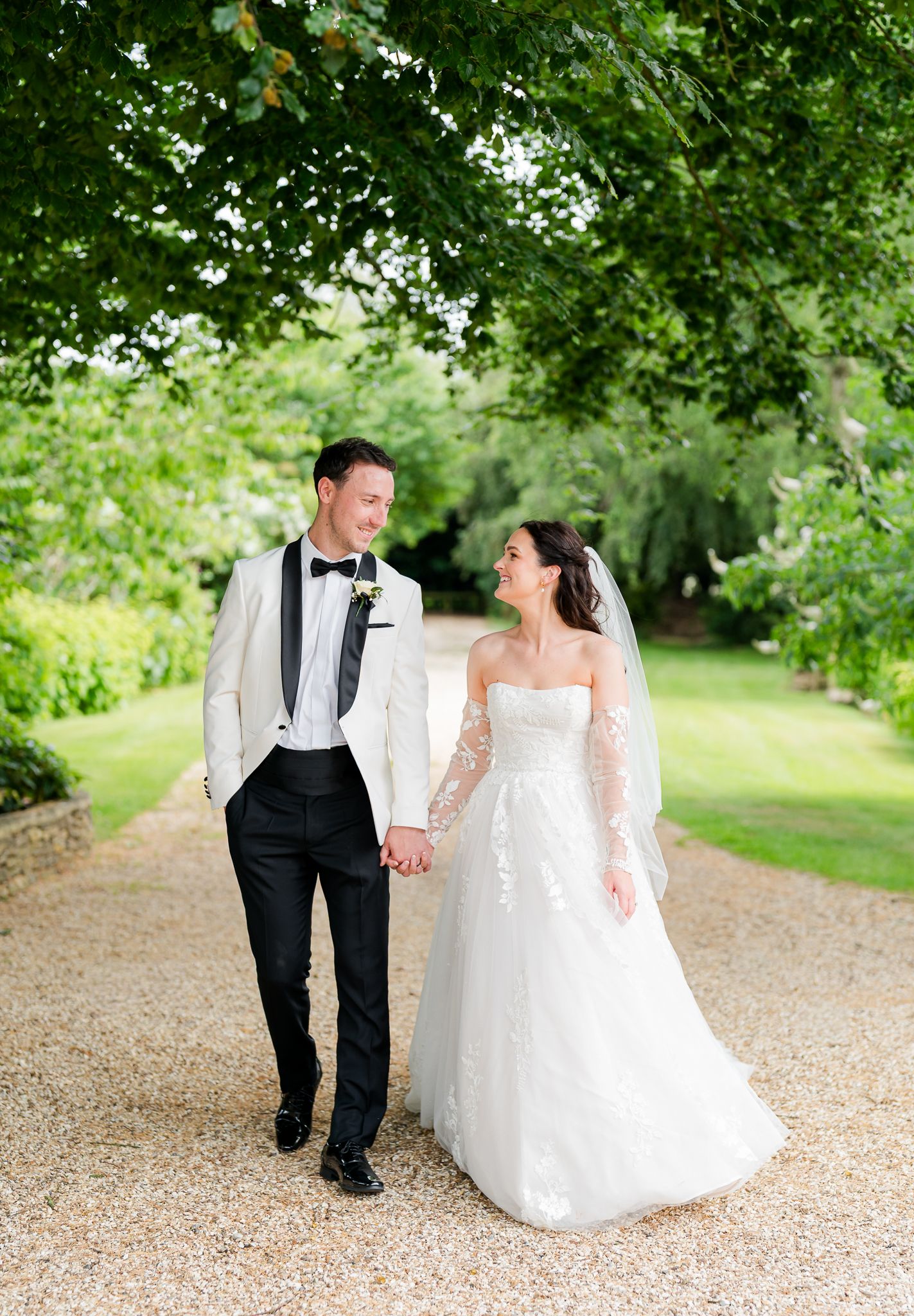 Kingscote Barn Newlyweds looking at each other laughing