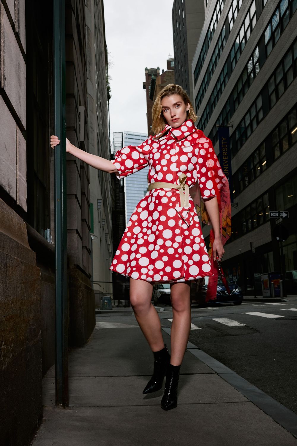 Model wearing red and white polka dot dress poses against urban backdrop in multi-panel street fashion photoshoot.