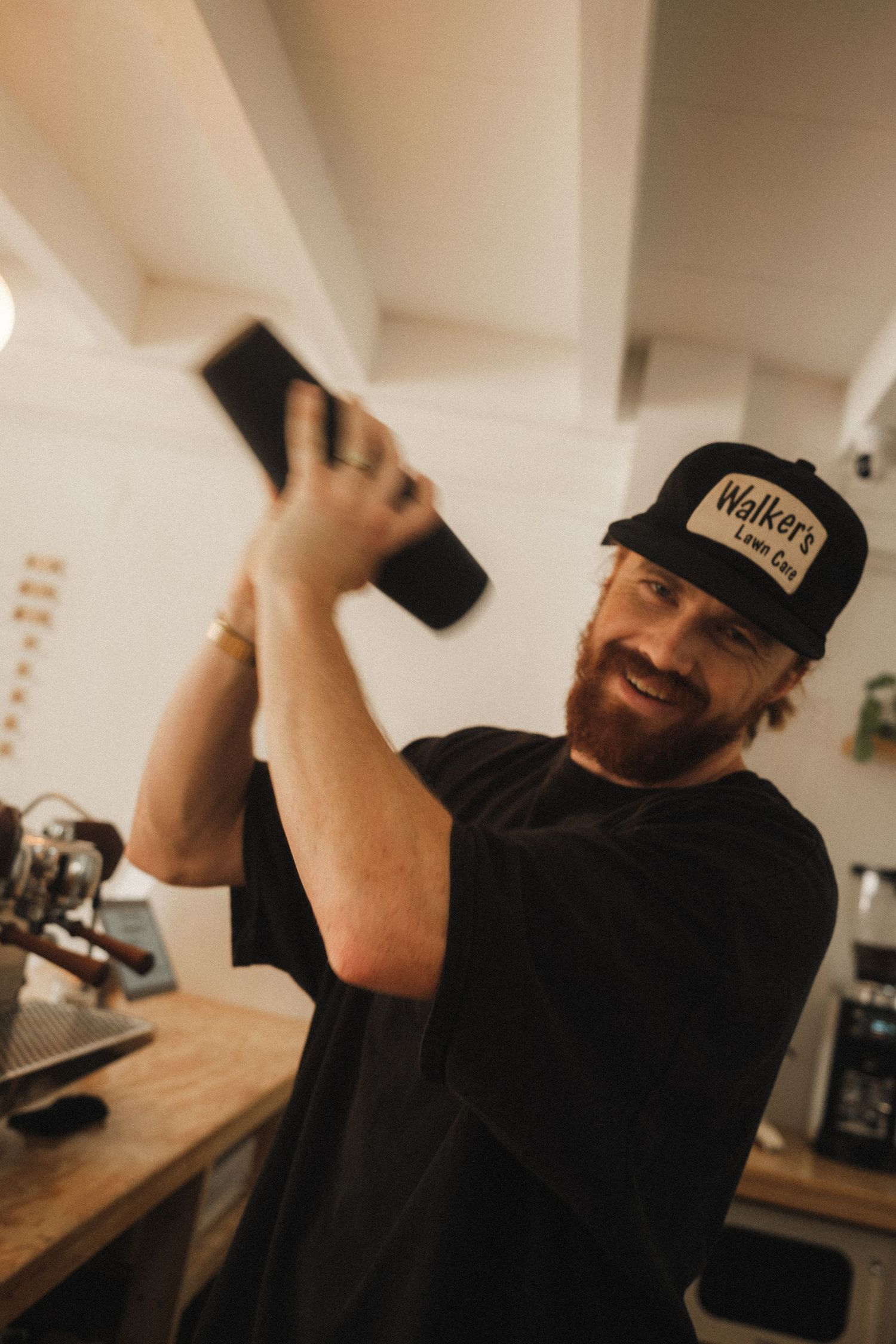 Series of casual candid photos showing someone in black shirt and baseball cap.