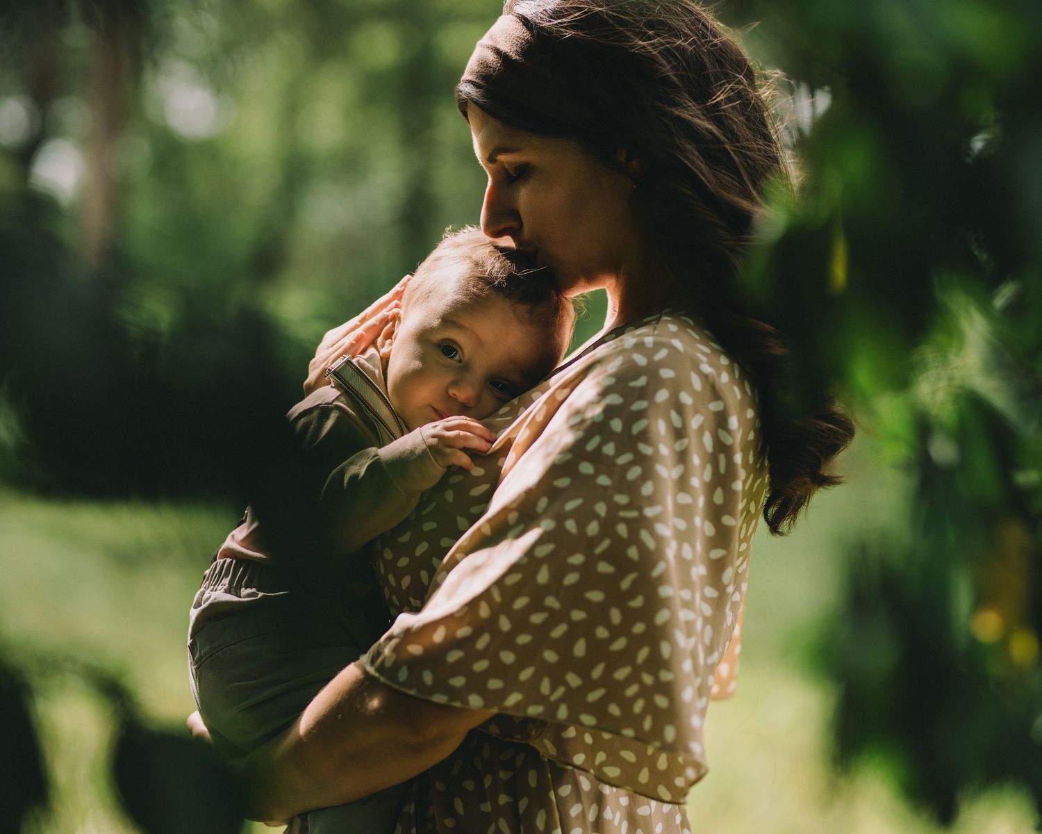 mother holding her baby the woods in florida