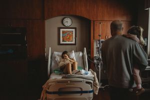 A quiet moment in a dimly lit hospital room with medical equipment.