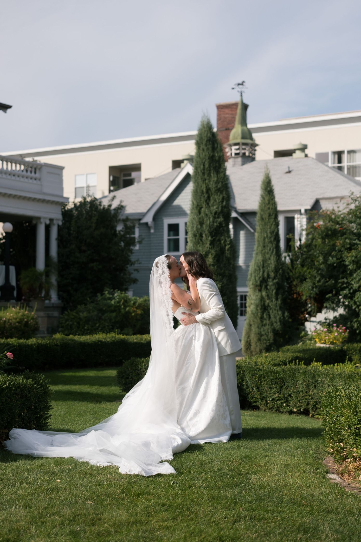 Wedding photos showing a romantic moment with pink hydrangea bouquet and white veil.