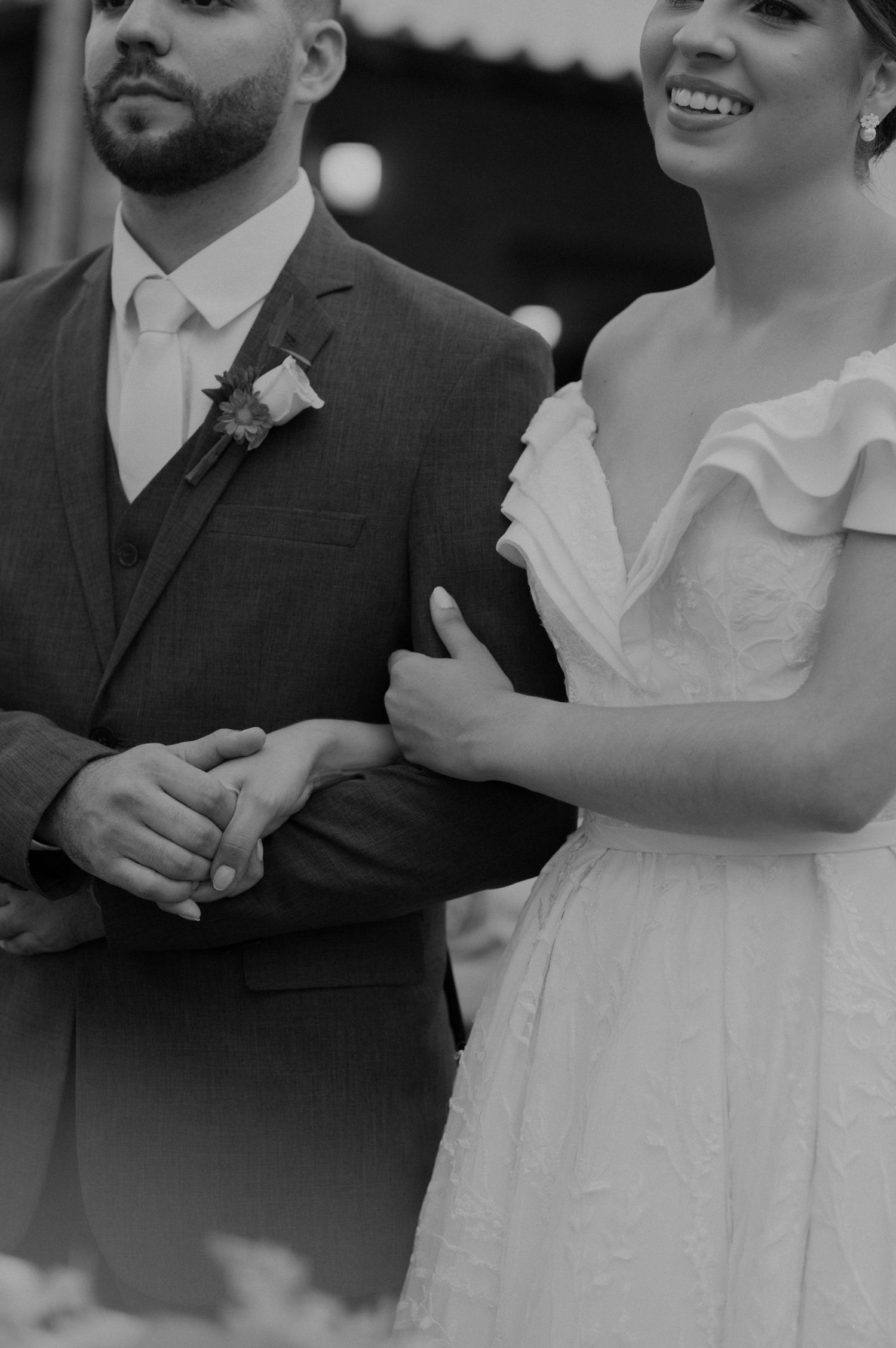 Black and white portrait of newlyweds during their wedding ceremony.