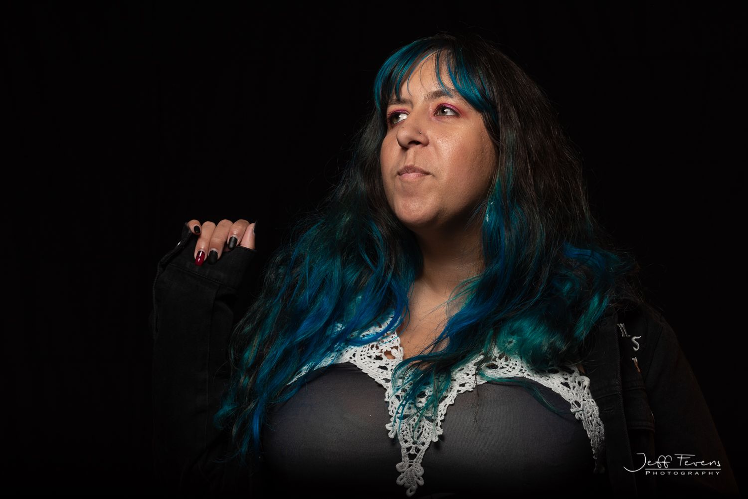 Studio Portrait of a woman with blue hair.