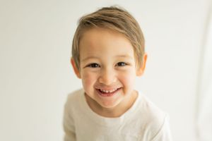 Close up portrait against white background with natural lighting.