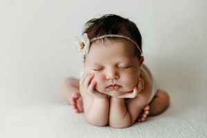 Gentle newborn photography series on light background showcasing peaceful sleeping poses.