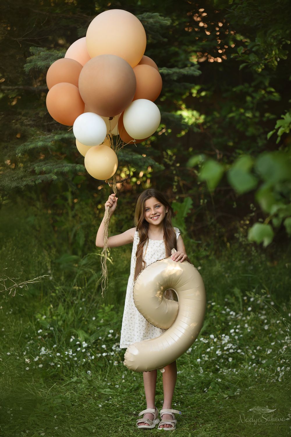 A series of outdoor photos with balloons and a glittery letter P prop in a natural garden setting with wildflowers.
