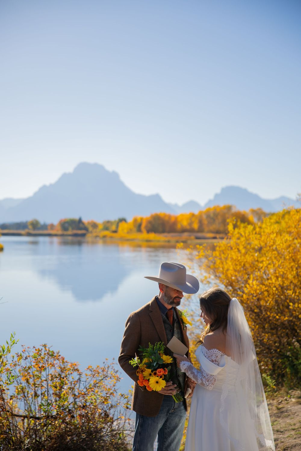 Elopement couple shares vow at Oxbow Bend in Grand Teton National Park