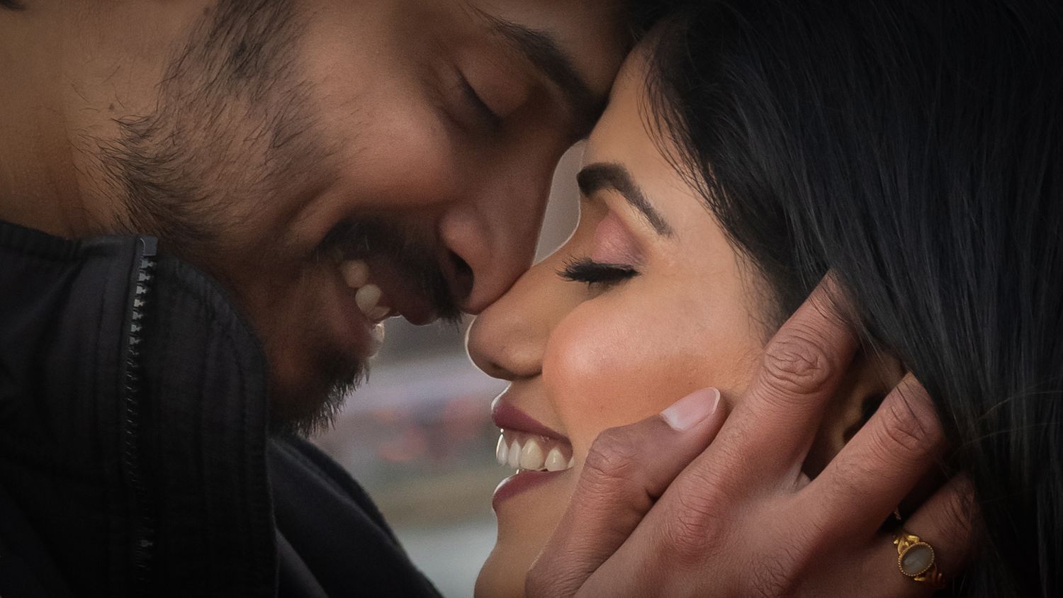 Intimate moment captured in dramatic close-up portrait.