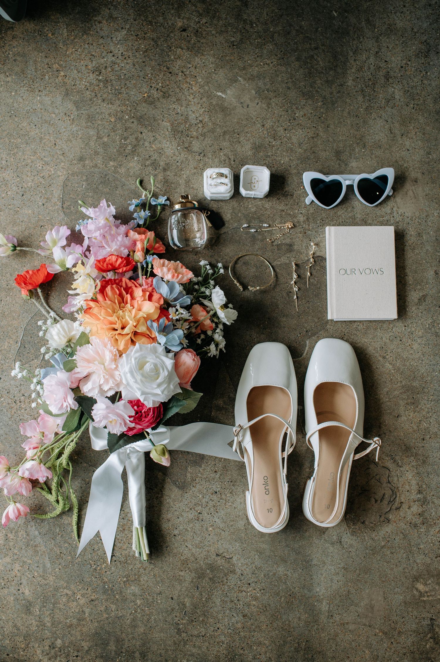 A celebratory recessional moment at an outdoor garden wedding ceremony.