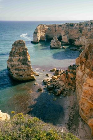 Natural stone arches and rock formations at Ponta da Piedade in Lagos, Portugal.