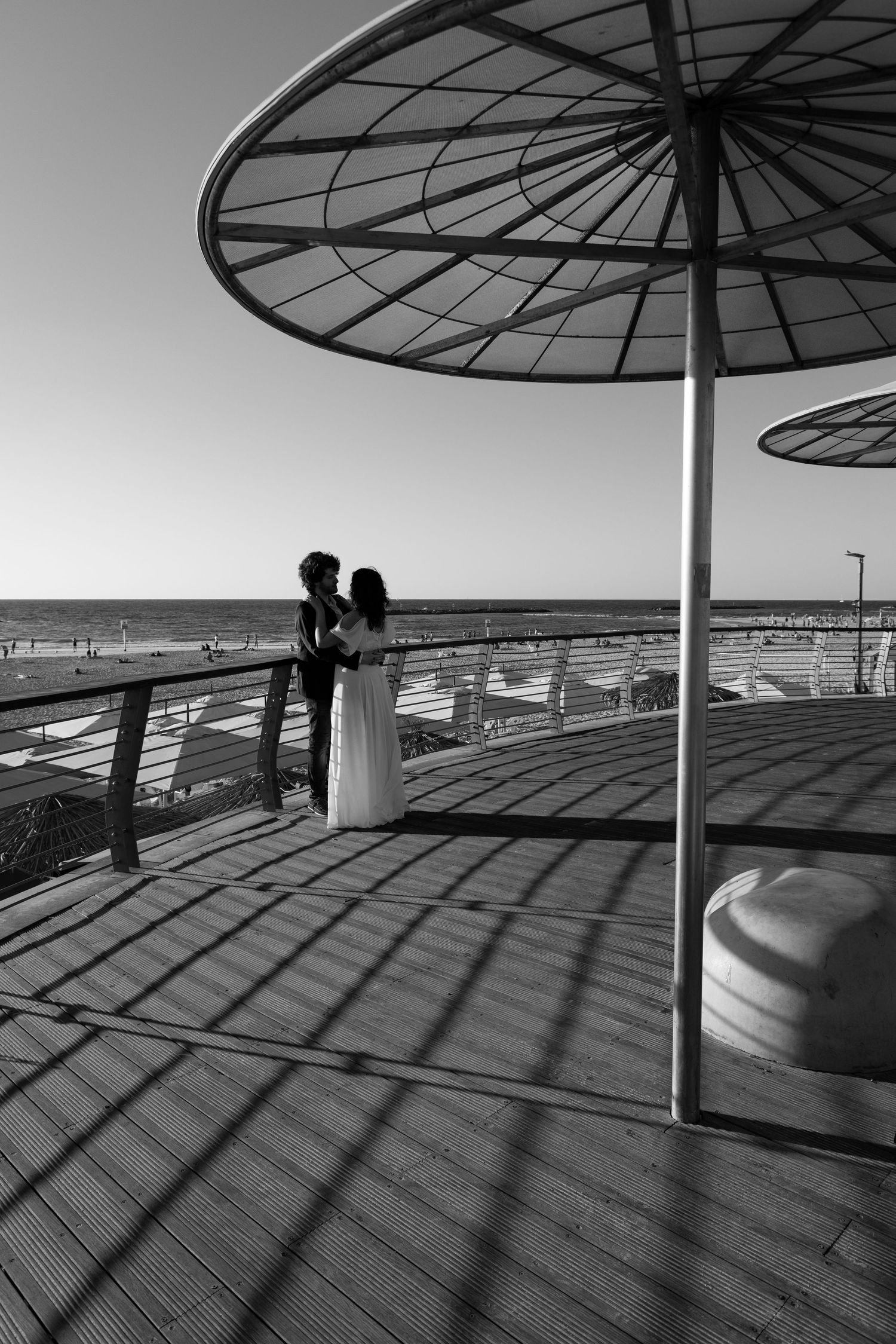 Golden Hour portrait of bride and groom at the Tel Aviv beach,