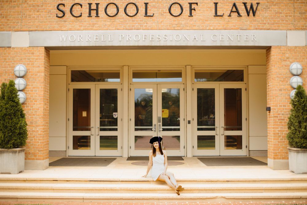Exterior view of law school building with brick facade and entrance steps.