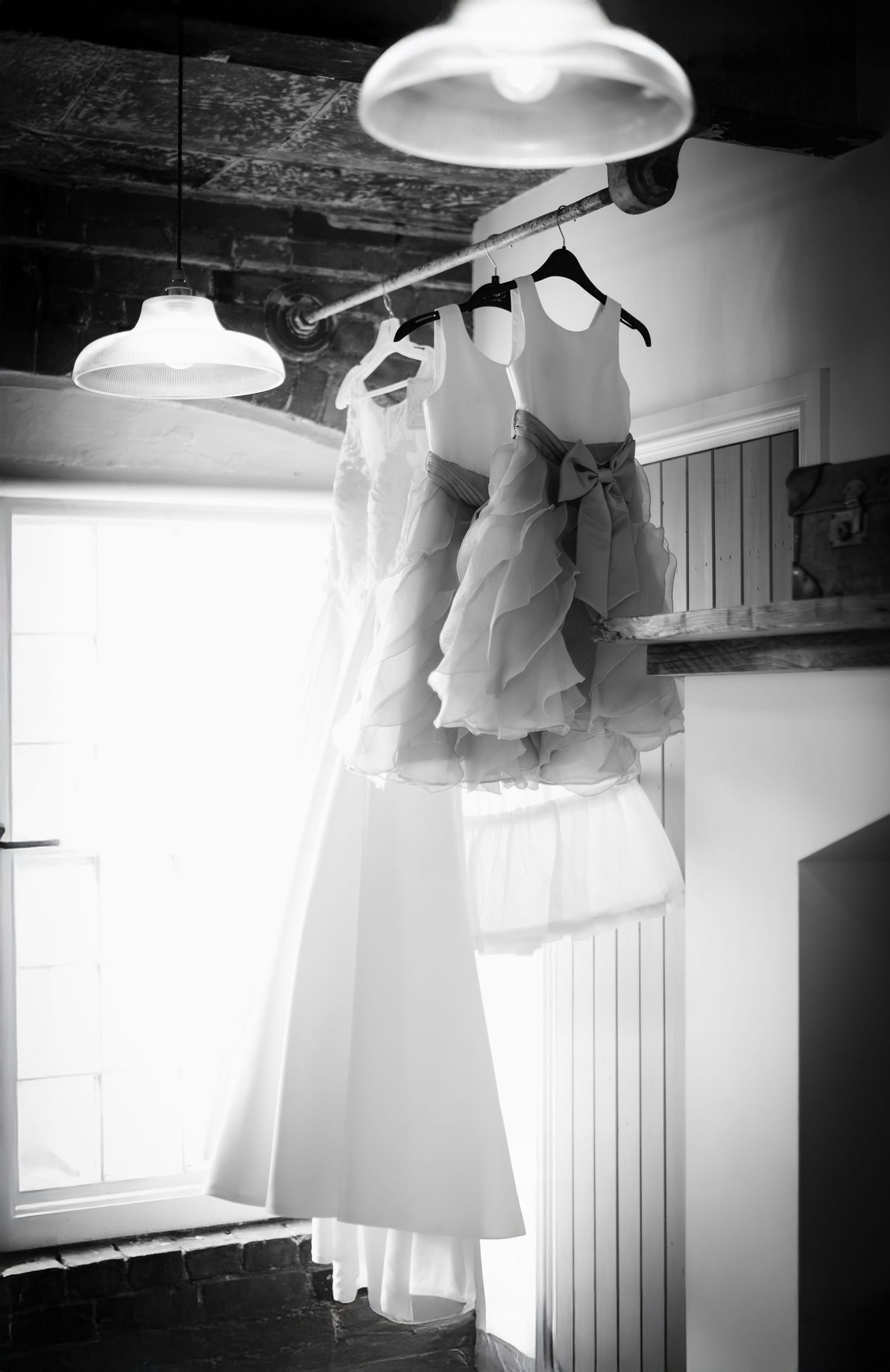bride walking down the aisle with father in the ceremony space at The West Mill Derbyshire wedding venue