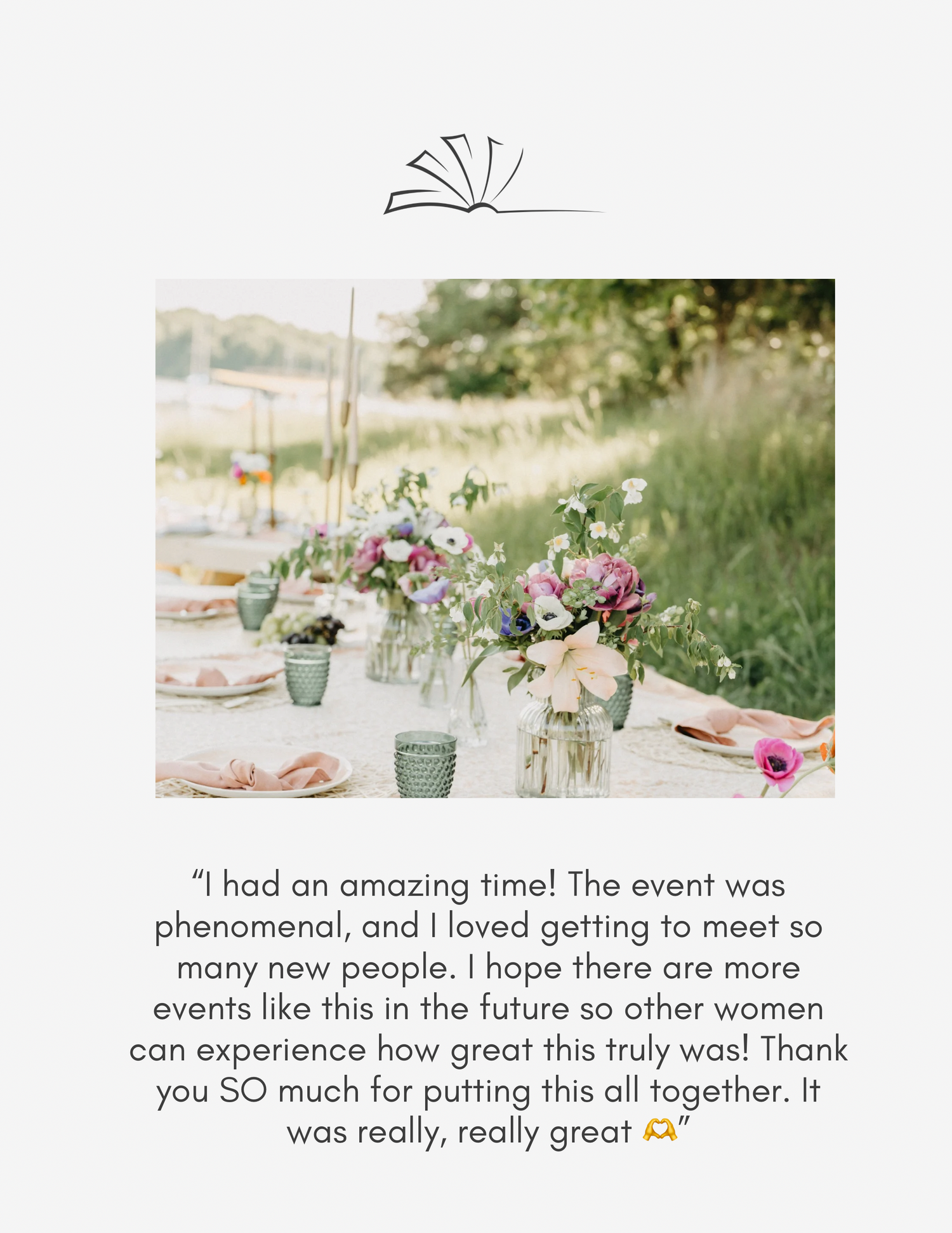 Elegant outdoor women's event with floral table setting in a meadow, featuring pink and purple wildflower arrangements.