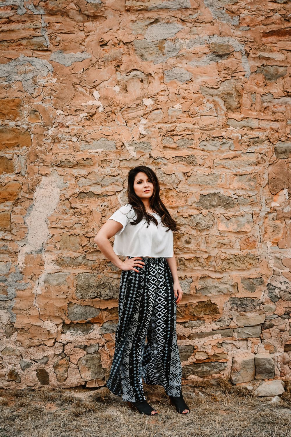 Editorial portraits of girl modeling in the Dallas-Fort Worth metroplex in neutral boho outfit