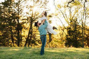 A couple pose for their engagement session at Caney Ridge Ranch in Claremore, Oklahoma.