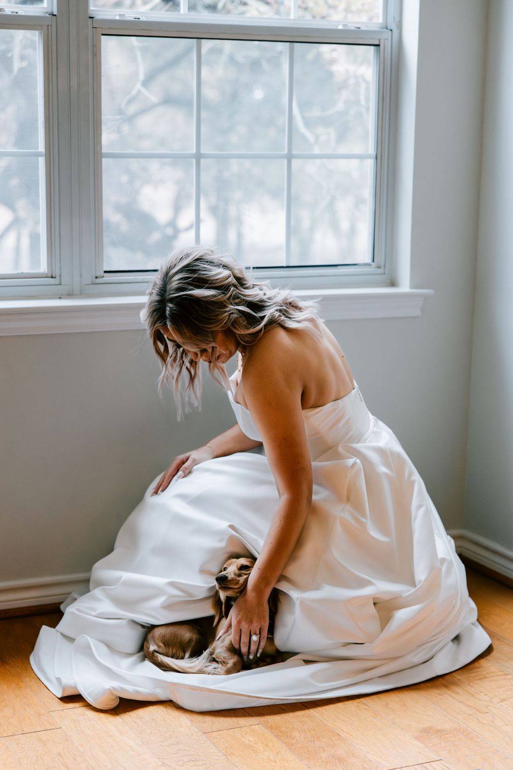 A bride's bridal portraits with her dog on her wedding day located on the family sheep farm in Early, Texas.