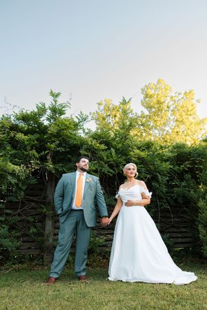 A couple poses outside their wedding venue at the Ravington in Centerton, Arkansas in the spring of 2026.