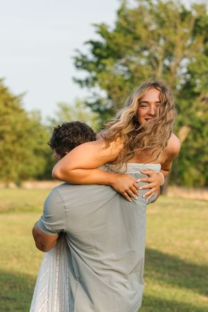 A couple pose for their engagement session at 810 Ranch and Cattle Co in Muskogee, Oklahoma.