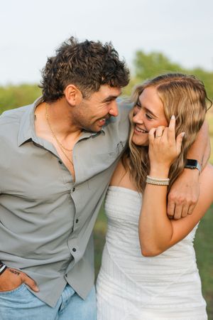 A couple pose for their engagement session at 810 Ranch and Cattle Co in Muskogee, Oklahoma.