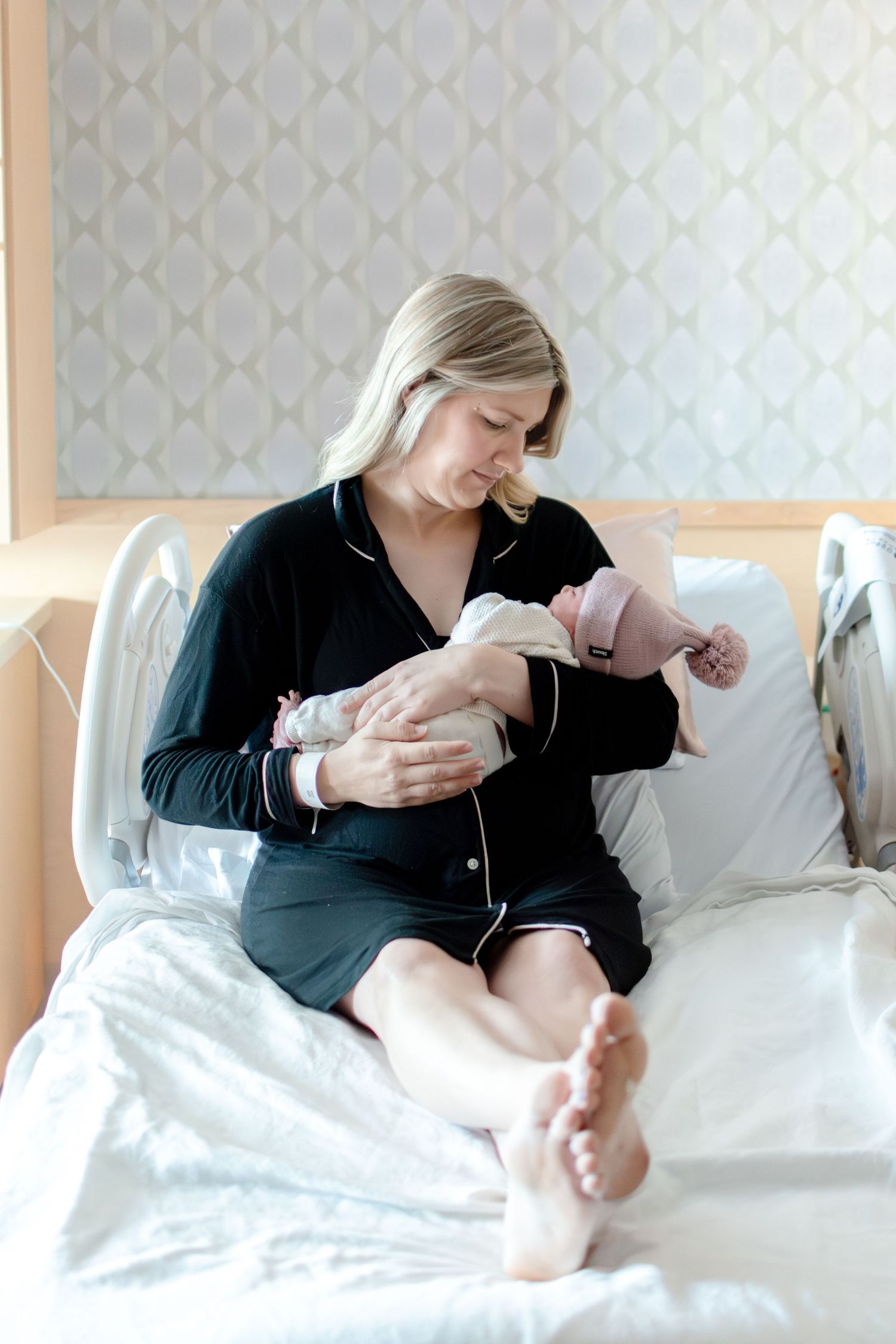 Mom holds newborn baby after delivery at Winston-Salem birth place.
