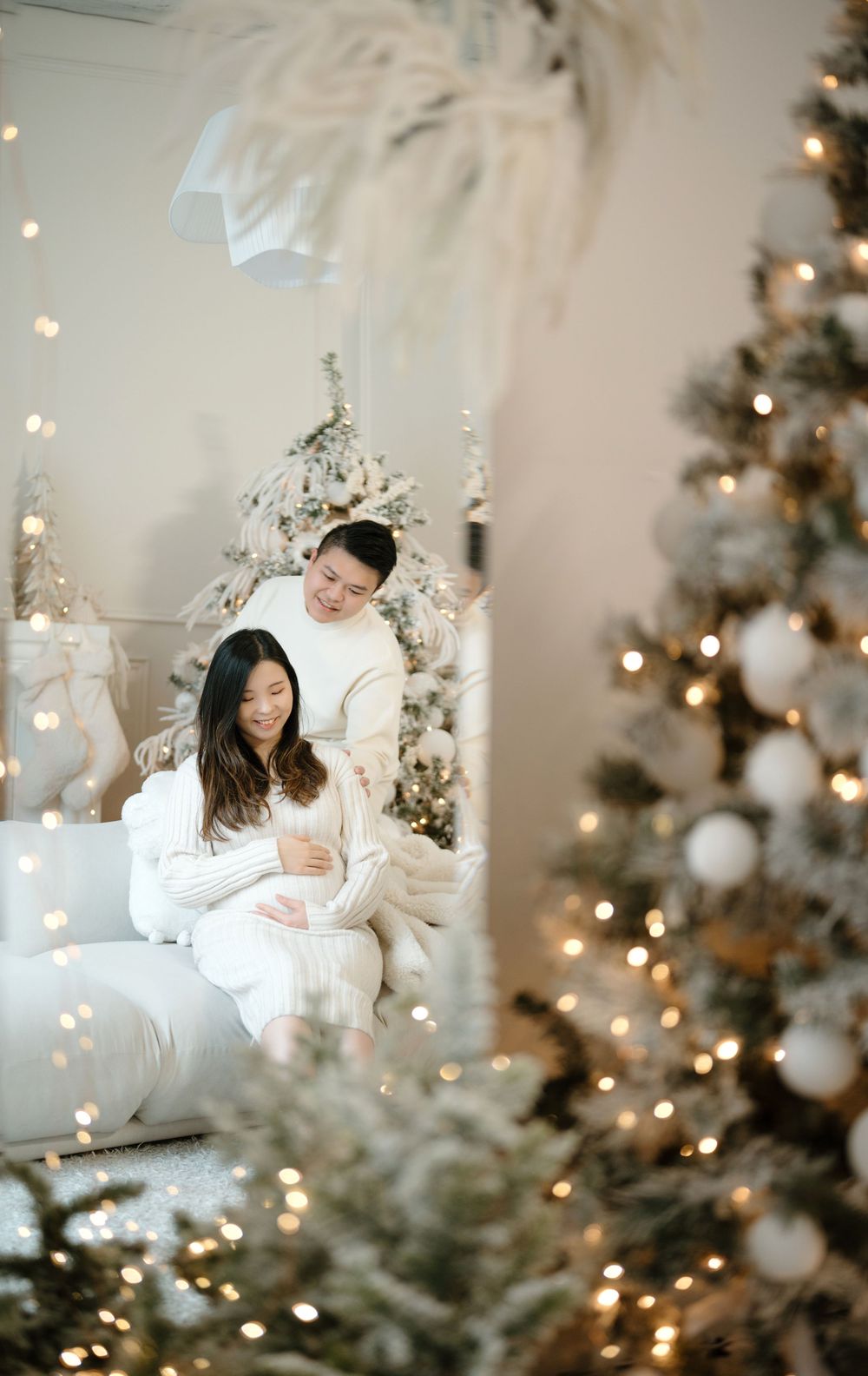 A dreamy Christmas scene with soft bokeh lights and decorated trees creating a cozy winter atmosphere.