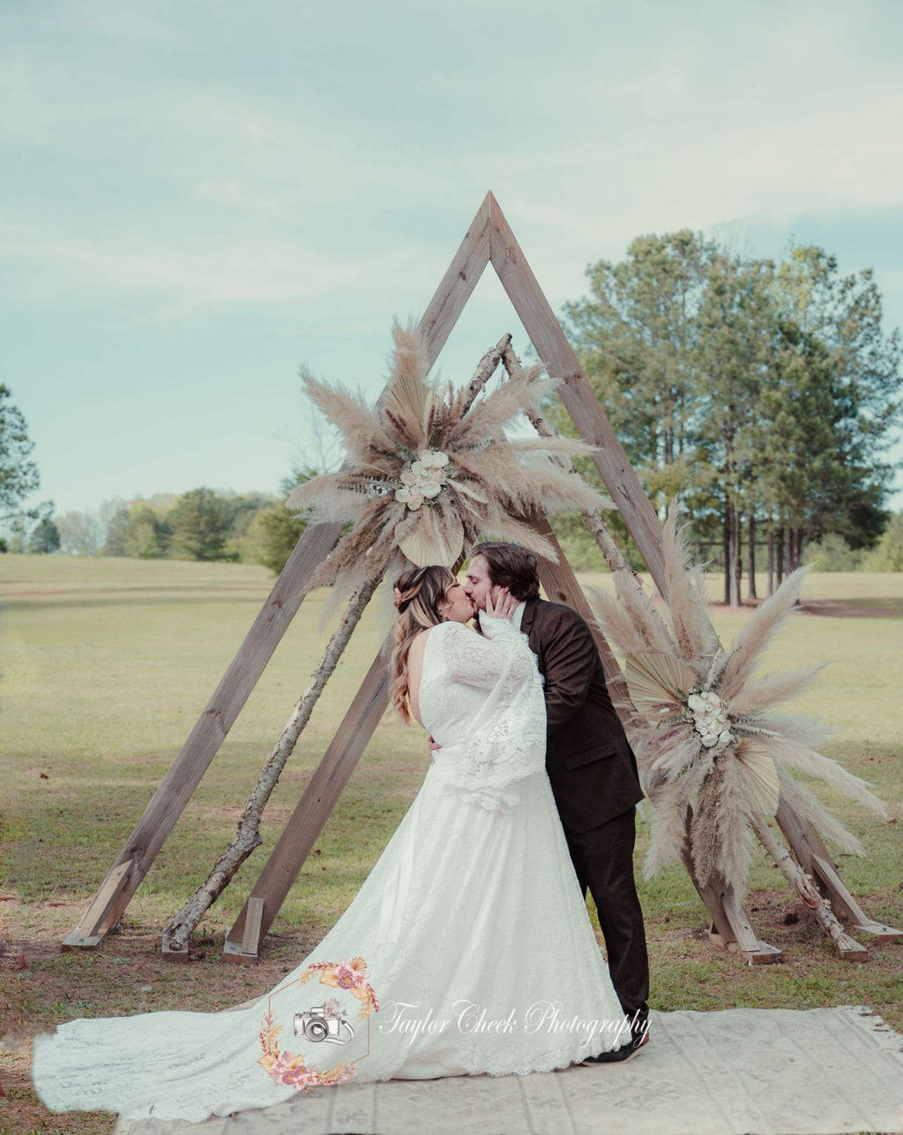 Boho wedding ceremony first kiss at Sanctuaire Atelier.