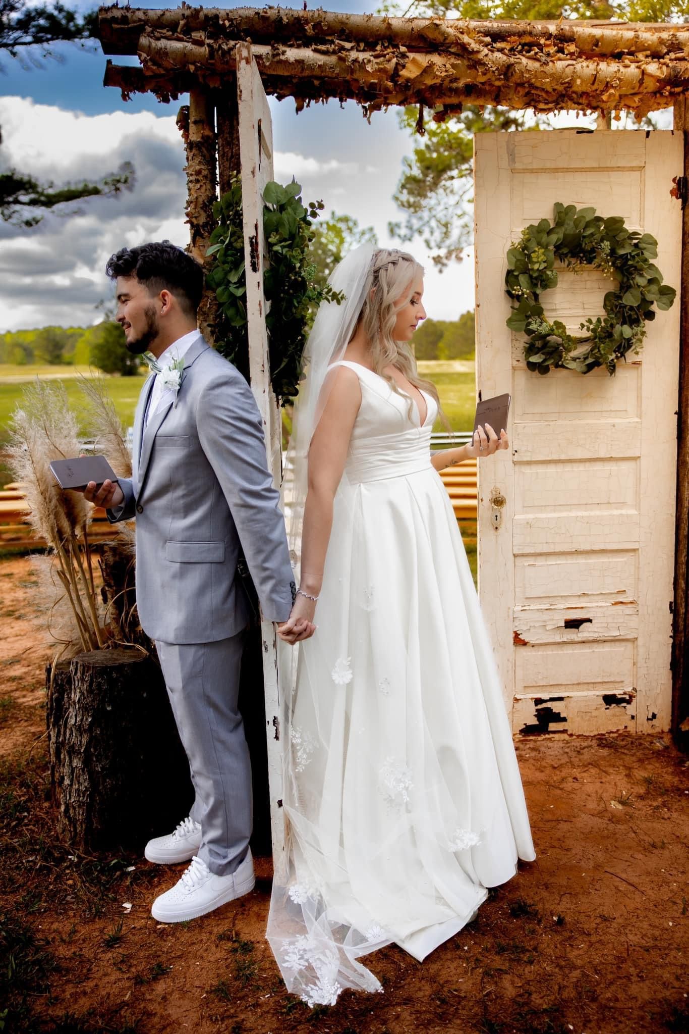 First touch wedding pictures in dreamy field venue at Sanctuaire Atelier.