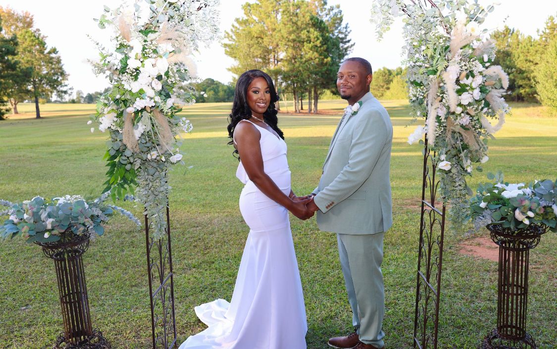 Black couple wedding in field at Sanctuaire Atelier