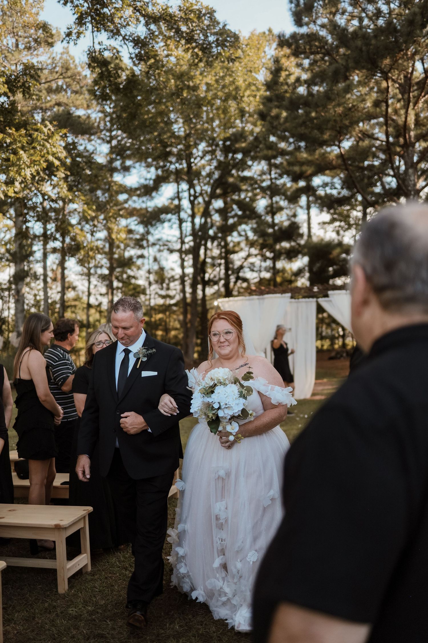 Dad walking daughter down the isle at wedding at Sanctuaire Atelier.