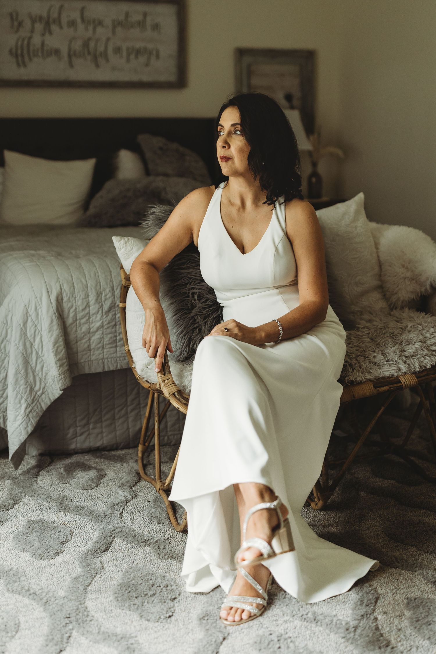 Bridal portraits in bedroom before wedding ceremony at Sanctuaire Atelier.
