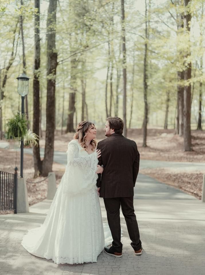 Bride and groom wedding portraits on stone bridge at Sanctuaire Atelier.
