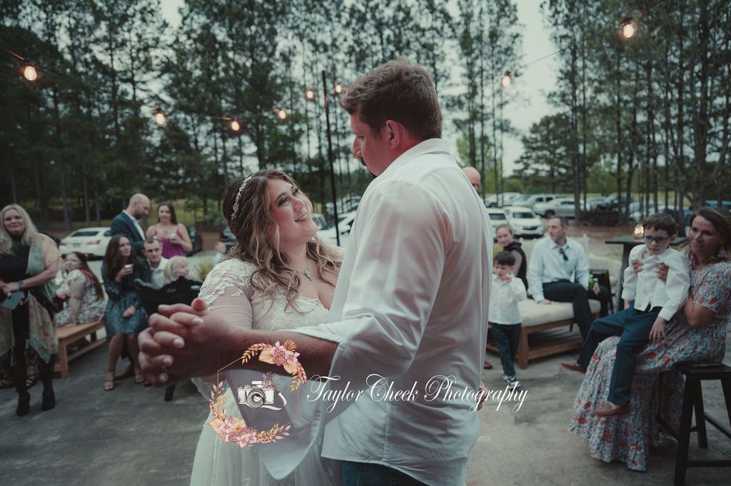 Couples first dance on patio at Sanctuaire Atelier.