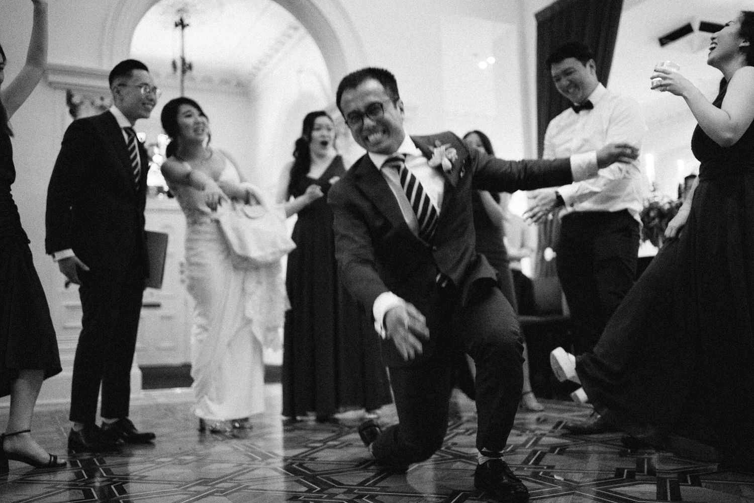 Bride's best friend about to do the headspin. Quat Quatta, Ripponlea, Melbourne.