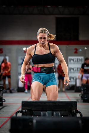 Athletes performing box jumps during an intense workout session.