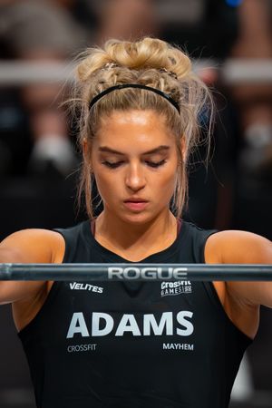 CrossFit athlete concentrating before attempting a heavy barbell lift at competition.