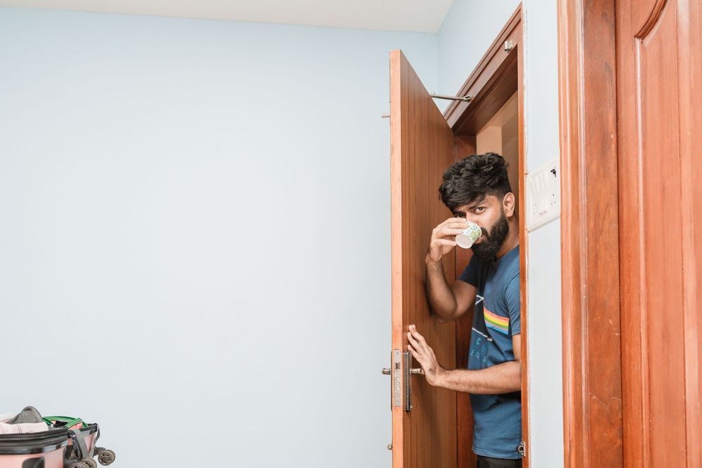 A tender moment captured through a partially opened wooden door.