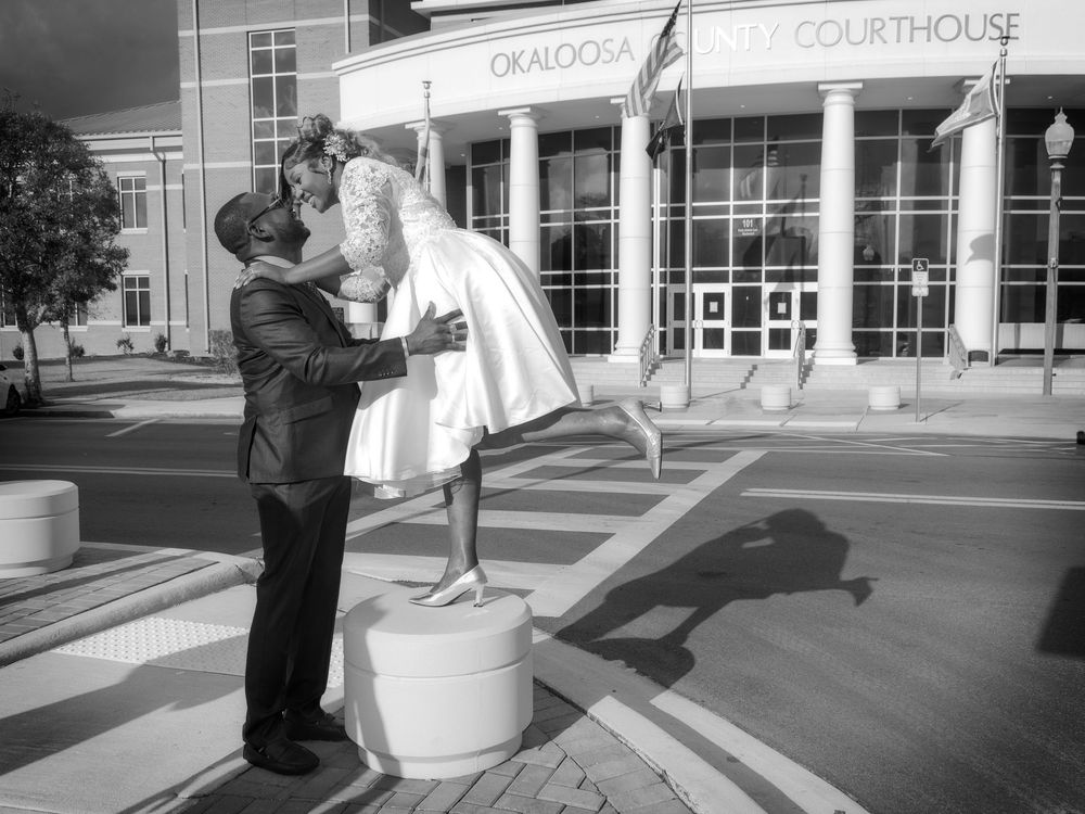 A series of black and white photographs showing a courthouse building entrance and people interacting outside.