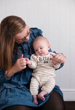 Mum and baby boy talking and cuddling, making the bond between mother and son