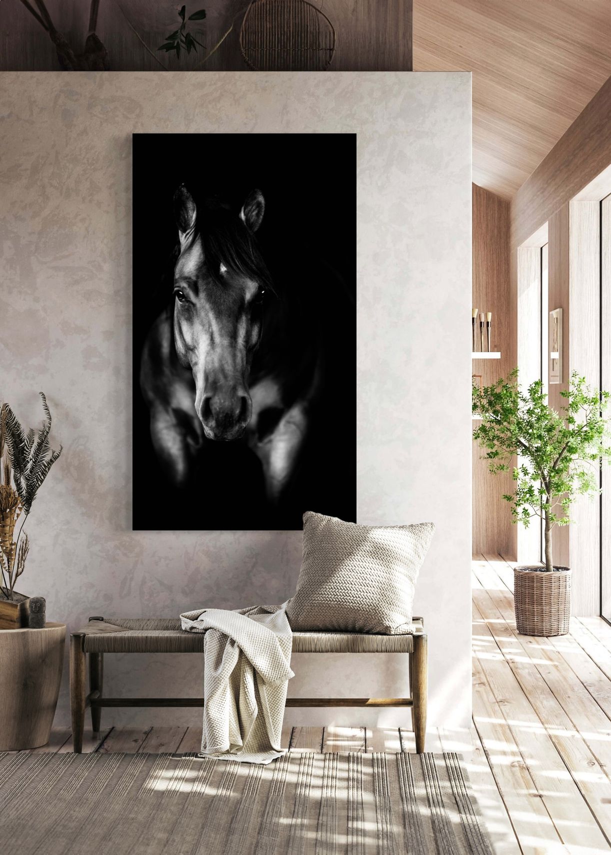Dramatic black and white horse portrait displayed in modern minimalist room with plants.