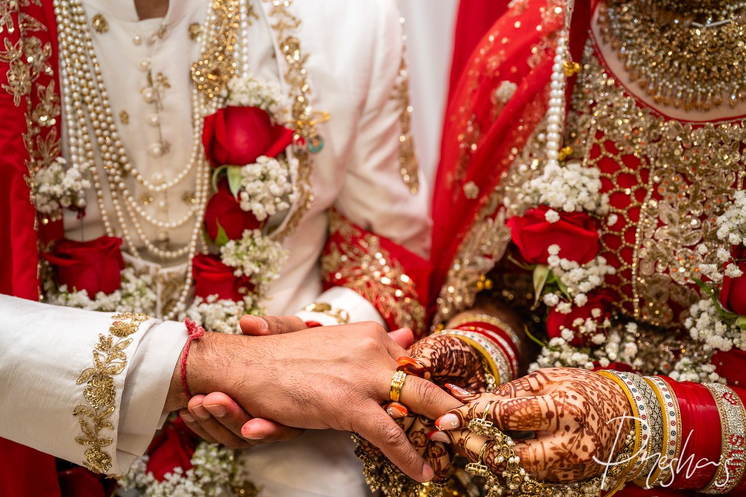 Bride and groom during traditional Indian wedding ceremony.
Candid moment of Indian bride in red bridal lehenga.