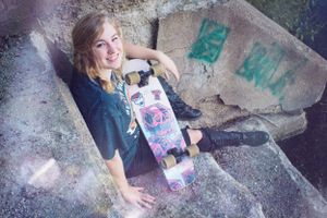 Artistic portrait series on rocky terrain with urban elements.